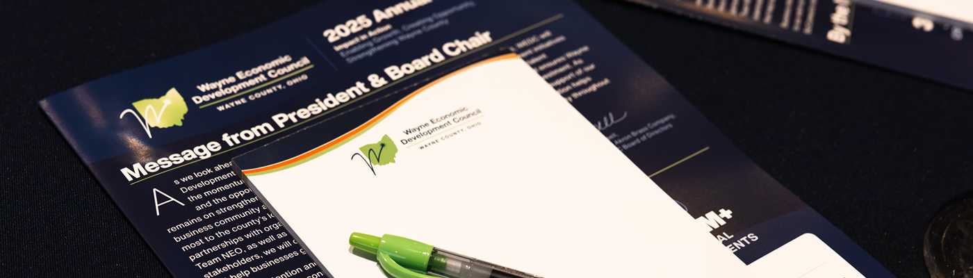 Wayne Economic Development Council documents and pen on a table.
