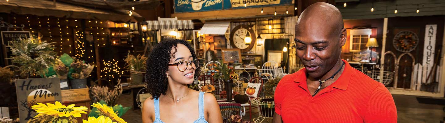 two people in an antiques market