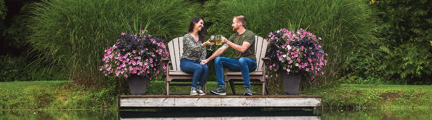 two people clinking glasses